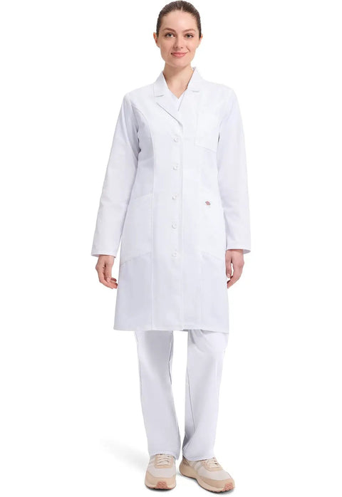Woman wearing Contemporary Fit Women's 37 Inch Twill Fitted Lab Coat With Notched Lapels And Button Front In White, showing full front view.
