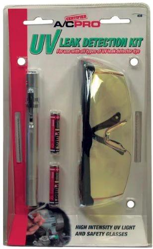 A/C Pro UV Leak Detection Kit blister pack including several test vials, yellow-tinted safety glasses, and a pen light