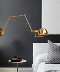 Top Shelf Heavy Duty Metal Swing Arm Wall Sconce Featuring Smooth Adjustable E27 Bulb Socket For Modern Bedrooms And Hallways classic bronze fixture in stylish bedroom setting.