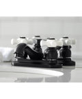 Black Retro Vibe Restoration 4-Inch Centerset Lavatory Faucet With Porcelain Cross Handle For A Classic Bath Upgrade, side view