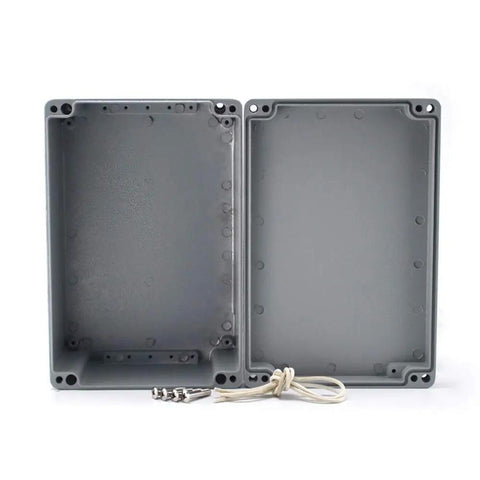 Hella Tough Aluminum Junction Box Featuring IP66 Waterproof Seal And Reliable Heat Dissipation For Demanding Outdoor Cable Runs And Switch Installations In Grey Finish sized at 9.4 by 6.3 by 4 inches, open view showing interior.