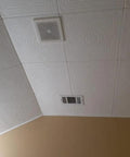 No Sweat Glue Up Foam Ceiling Tiles EZ Install Hides Popcorn Texture Fast Lightweight Styrofoam installed on a ceiling.