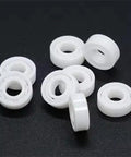 Front view of white 608 ceramic bearings for skateboards, 8x22x7mm, set of several rings.