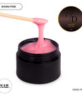 HEMA Free Warm Pink Hard Gel For Nails in black jar being applied with a spatula, 15ml size, glossy finish