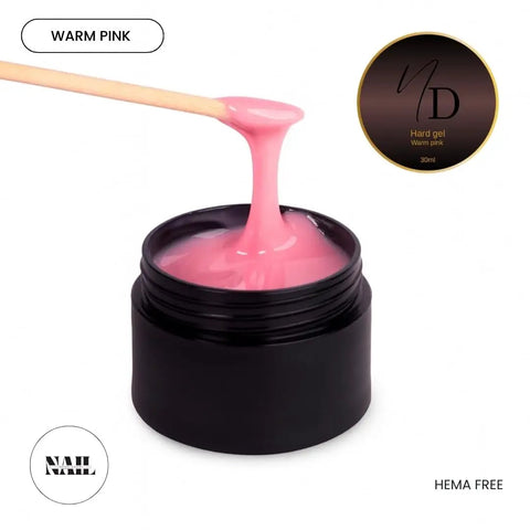 HEMA Free Warm Pink Hard Gel For Nails in black jar being applied with a spatula, 15ml size, glossy finish