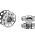 Close-up of bobbins from 22 Piece Pro Grade Stainless Steel Sewing Machine Bobbin Set For Embroidery And Crafting Rust Resistant Durable Bobbins