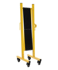 Heavy Duty Yellow And Black Folding Security Gate Built Like A Tank With Top Shelf Craftsmanship Smooth Rolling Casters And Quick Expand Adjustable Scissor Barrier For No Sweat Crowd Control, folded with wheels.