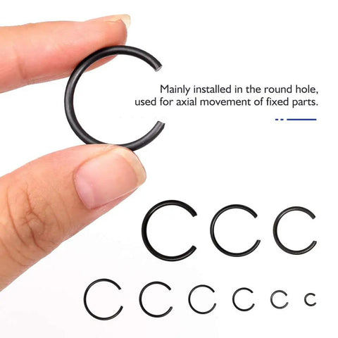 65Mn Spring Steel Snap Ring Set For Hole Sizes 4Mm Through 20Mm Round Wire Bearing Stop Rings Assortment Kit, close-up of snap ring in hand, sizes shown.