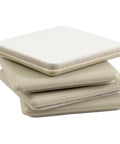 Stack of four beige Two And A Half Inch Self Stick Square Furniture Sliders For Carpet And Hard Surfaces Anti Slip Adhesive Pads