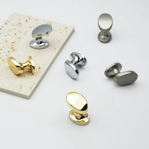 4 Pack Polished Brass Cabinet Knobs Set Solid Zinc Alloy Pulls on display with silver knobs for kitchen and bathroom furniture.