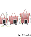 Expandable Travel Tote Bag With Trolley Sleeve And Wheels, size comparison, waterproof pink Oxford duffel, expands 14 to 22 inches