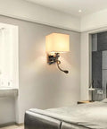 Totally Adjustable Swing Arm Wall Sconce With Soft Fabric Shade And Classic E27 Mount Smooth Painted Steel Frame in cozy bedroom.
