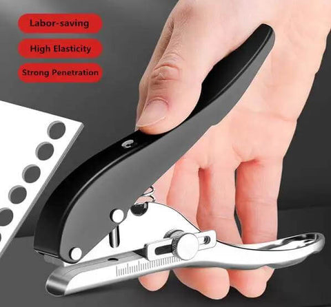 Beast Of A Heavy Duty Single Hole Punch Handheld Paper Punch with ergonomic handle and built-in spring in use on white paper