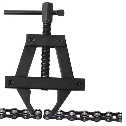 Heavy Duty Steel Motorcycle Chain Tensioner Tool Knockout Adjuster For Dirt Bikes And Cruisers close-up on chain and tool