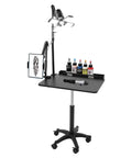 Smooth Rolling Adjustable Height Tattoo Workstation With Bright Led Panel And Smart Storage Rack For Your Professional Mobile Art Studio Daily Grind And Heavy Duty Gear with black table and LED light.