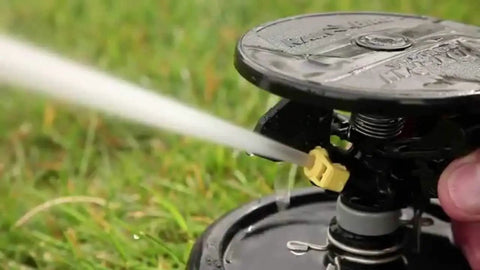 2045A Maxi-Paw Sprinkler Bundle With All 7 Nozzles Included Heavy-Duty Impact Drive spraying water on grass