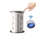 Total Game Changer Smart Motorized Pop-Up Power Station Featuring Six Ac Outlets, Four Usb Ports, Qi Wireless Charging Pad, Ip65 Waterproof Glass Top, Built In Speaker, And Adjustable Led Lamp For Your Sweet Home Office Setup with a hand operating the touch panel.
