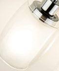 Close-up of 4 Light Chrome Vanity Fixture With Double Layer Anti Glare Glass Shades For Modern Bathroom Wall Sconce Lighting