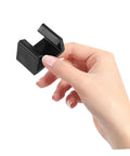 Hand holding black Outdoor Sectional Sofa Clips 4 Pack For Patio Furniture Easy Install Rattan Wicker Chair Fasteners