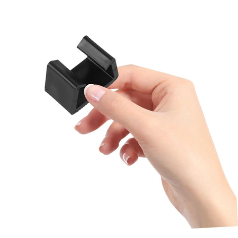 Hand holding black Outdoor Sectional Sofa Clips 4 Pack For Patio Furniture Easy Install Rattan Wicker Chair Fasteners