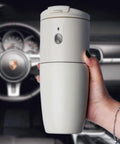 Go Getter Mini Coffee Maker With Integrated Bean Grinder, Fully Automatic Drip Free Espresso Brewer For Home Car Desk, Smart Compact Cup held in hand.
