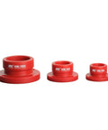 Red HSK-100A, HSK-63A, HSK-50A tool holder tightening fixtures for CNC equipment, showing front view of aluminum alloy construction.