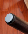 Close-up of chair leg with 8 Pack Furniture Glide Pads For Chairs And Tables Non Skid PTFE Rubber Protectors On Hardwood Floor