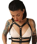 Adjustable Black Leather Chest Harness And Waist Chain Belt For Rave Festivals Nightclub Wear Sexy Belly Bra Streetwear Accessory For Women Serving That Baddie Energy on a model showing front view.