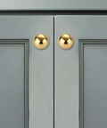 Unlacquered Brass Cabinet Knobs 5 Pack, Solid Brass Round Cabinet Pulls on gray cabinet, 1.1" diameter, classic hardware