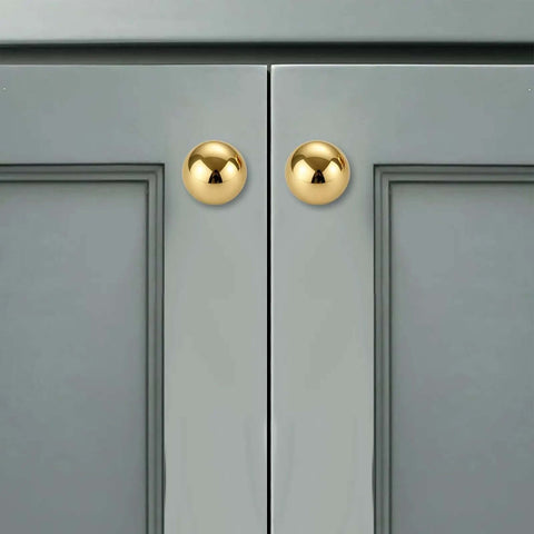 Unlacquered Brass Cabinet Knobs 5 Pack, Solid Brass Round Cabinet Pulls on gray cabinet, 1.1" diameter, classic hardware