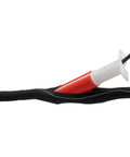 Wire Loom Insertion Tool Set For Three Eighths To Two Inch Conduit Sleeving in use with black cable bundle