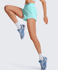 Woman wearing Turquoise High Rise Running Shorts With 2.5 Inch Inseam Built In Mesh Liner Feathery Fit Soft Fabric Quick Dry Elastic Waistband
