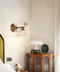 Ceramic Wall Sconce, 9 Inch Brass Vintage Light mounted beside a bed featuring an elegant patterned shade in a cozy bedroom.