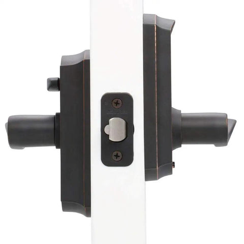 Side view of aged bronze electric touch screen entry lock with Camelot lever, showing steel construction and lock mechanism