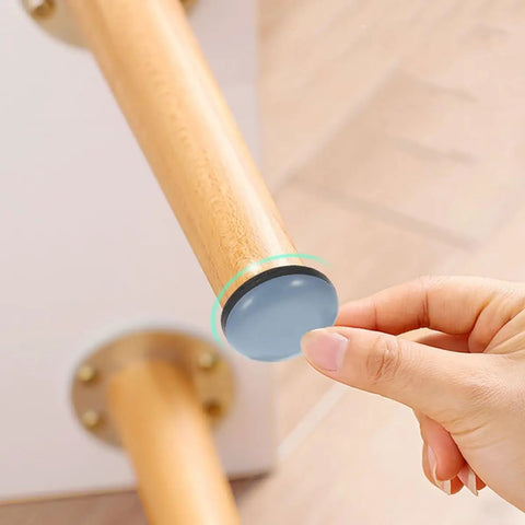 Reusable PTFE Appliance Sliders For Hardwood Floors being attached to wooden furniture leg