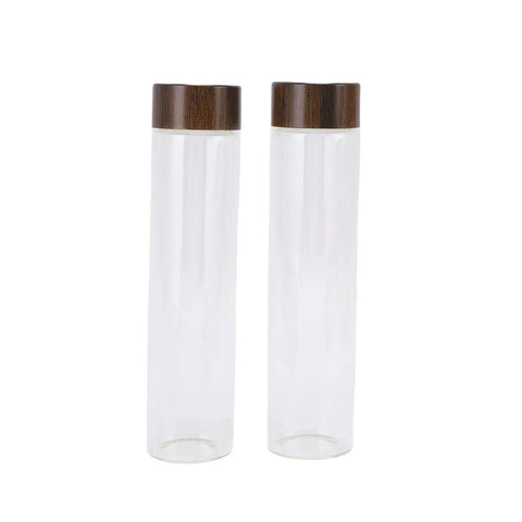 Slay Your Kitchen Game With This Top Shelf Airtight Coffee Bean Cellar Featuring Durable Walnut Wood And Sleek Glass Tubes To Lock In Peak Freshness For Serious Baristas - two clear glass tubes with walnut lids