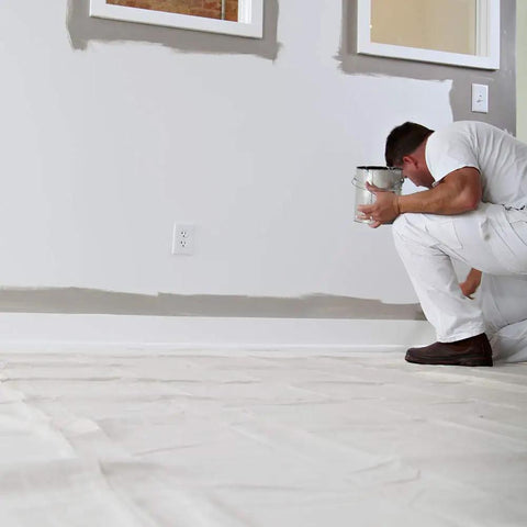 Painter using Heavy Duty Canvas Drop Cloth 4 Ft By 12 Ft Tan Protect Floors From Paint Spills In Hallways And Narrow Spaces