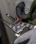 Wire Stripper And Cutter For 8-16 AWG Solid And 10-18 AWG Stranded Wire With Locking Mechanism held by gloved hand