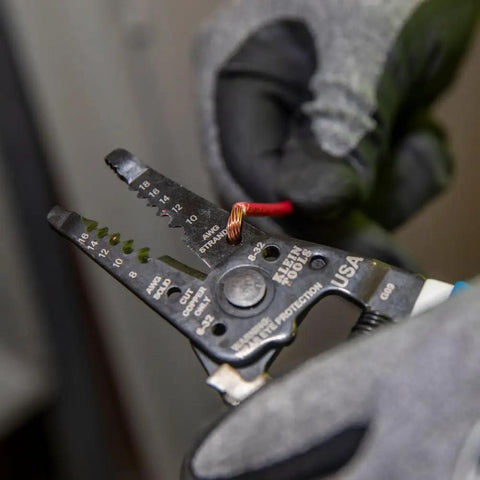 Wire Stripper And Cutter For 8-16 AWG Solid And 10-18 AWG Stranded Wire With Locking Mechanism held by gloved hand