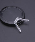 Pro Grade Rock Solid Gold Silicone Nose Pads For Glasses And Sunglasses Dead Stop Saddle Grip with a clear silicone nose pad on a black background.