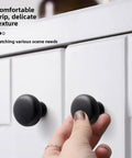 Hand gripping brushed nickel cabinet knobs and pulls for drawers and closet doors fingerprint resistant durable kitchen and bathroom hardware