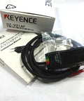 Keyence CZ-V21AP Fiber Optic Color Mark Sensor PNP Output shown with packaging and cables, ideal for automation and color detection.