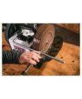 10-Inch Aluminum Oxide Grinding Wheel 220 Grit For JWS-10 Wet Sharpener in use sharpening chisel on wooden workbench