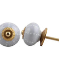Slick Dotted Ceramic Grey Drawer Knobs 100 Pack For Kitchen Cabinets And Dressers with gold accents and smooth grip.