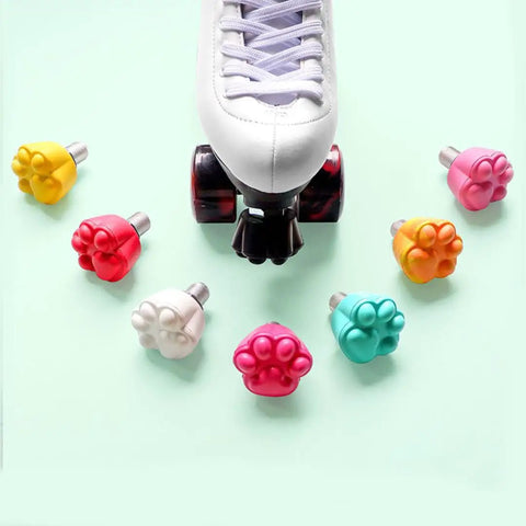 Two Pack Cat Paw Toe Stops For Quad Roller Skates 82A in mixed colors around a white skate, adjustable height rubber brake blocks