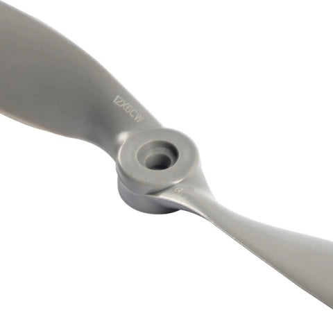 Close-up of gray 2 Vane Direct Drive Nylon RC Propeller Set with Adapter Rings for Airplanes Drones Gliders, CW and CCW, 12x6 size