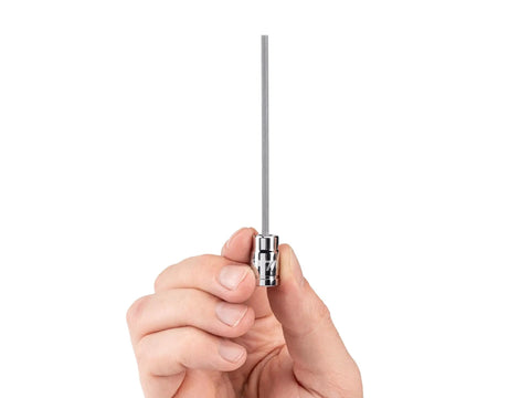 Hands holding One Quarter Inch Drive Hex Bit Socket Long Reach Size 7 64 Inch Pro Grade For Deep Fasteners Chamfered Edges