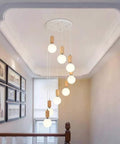 Top Shelf Three Head Disc Pendant Ceiling Light With Milky Frosted Glass Lampshades And Heavy Duty Wrought Iron Frame for stairwell use.