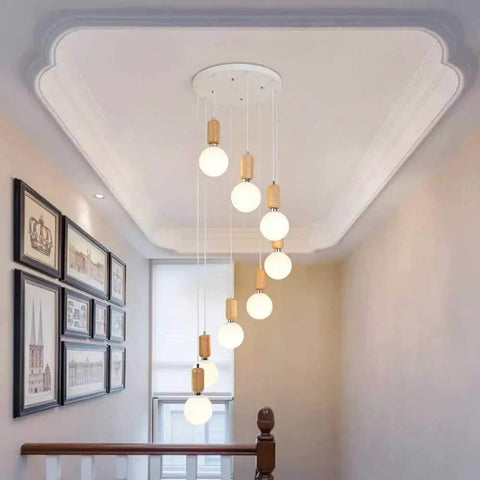 Top Shelf Three Head Disc Pendant Ceiling Light With Milky Frosted Glass Lampshades And Heavy Duty Wrought Iron Frame for stairwell use.