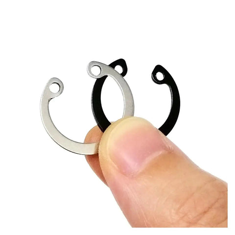 Handy DIY Snap Ring Kit 8 To 24 Mm Internal C Type Circlips Retaining Clips Set In 304 Stainless Steel And 65Mn Steel With Black Finish Washers Included For Home Maintenance And Small Projects, three rings held by hand